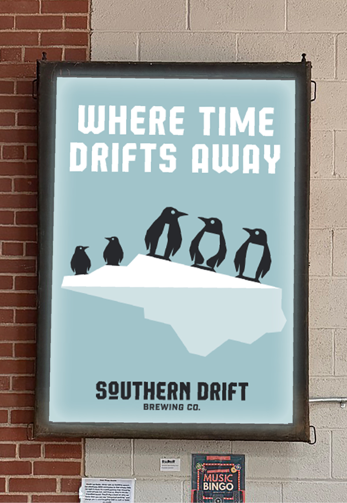 Interior poster featuring Southern Drift's penguin mascots on a NC State shaped iceberg