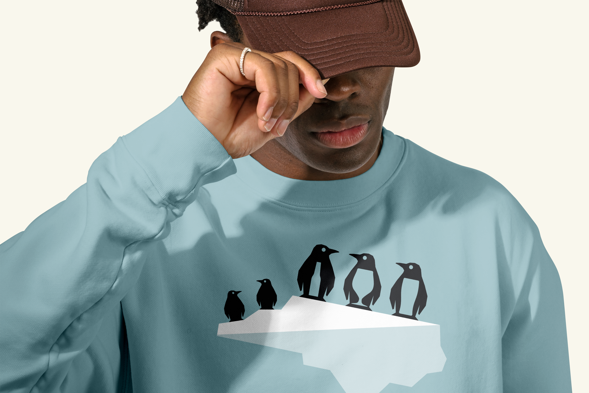 Sweatshirt featuring Southern Drift's penguin mascots on an NC State shaped iceberg